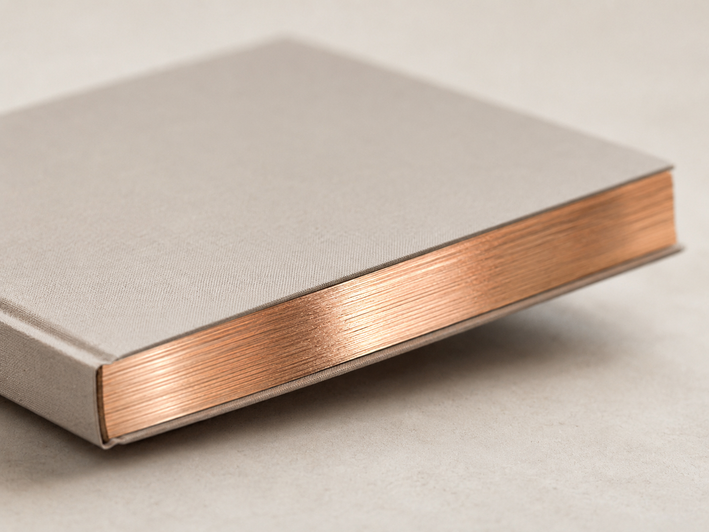 Hardcover book with copper foil-finished page edges.