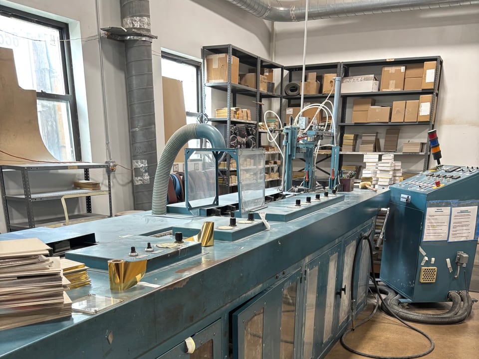 Edge gilding equipment in a working shop.