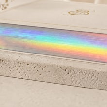 Holographic foil edge finishing sample.